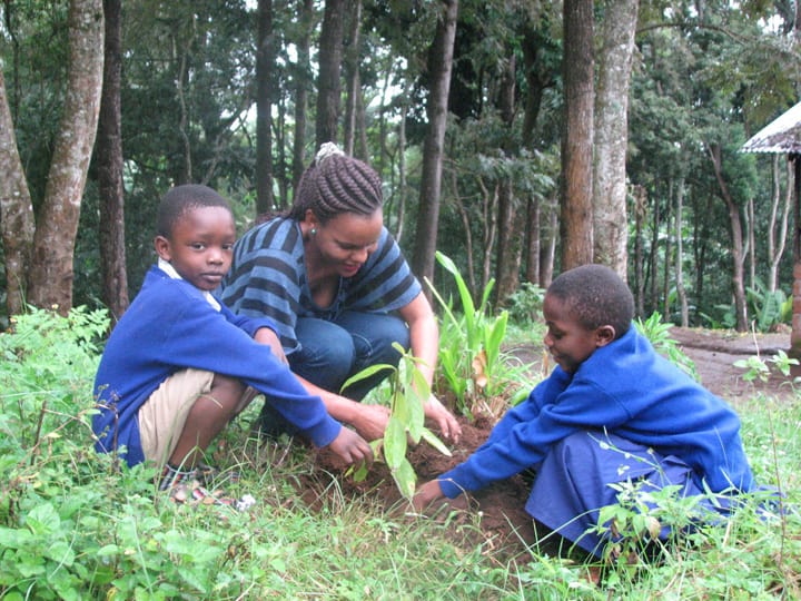 Environmental teacher Magreth Mwanga with students on Kilimanjaro