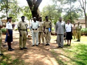 2012 - Sebastian Chuwa (r front) consults with officials of the Police Training School on occasion of mpingo tree planting initiative.