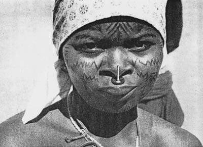 Ancient cultural tradition of Makonde - Facial scarification and blackwood noseplug in upper lip