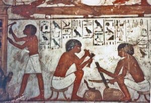 Detail - Carpenters working blackwood. Mural on wall depicts the Egyptian God Horus, the falcon, symbol of protection, royal power and good health.
