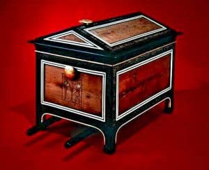 This portable chest is the only one in the collection with carrying poles beneath, thought to be because of the heavy weight of its contents. It is made of cedar and blackwood and decorated with blackwood and ivory veneer.