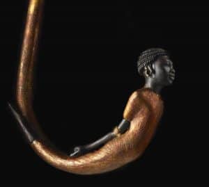 One of 130 walking sticks found in Tutankhamun’s tomb. The crook of this one, carved from blackwood, depicts a bound African prisoner.
